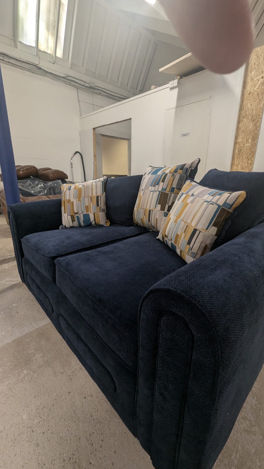 Navy blue 2-seater lounger fabric sofa with patterned cushions, offering ultimate comfort.