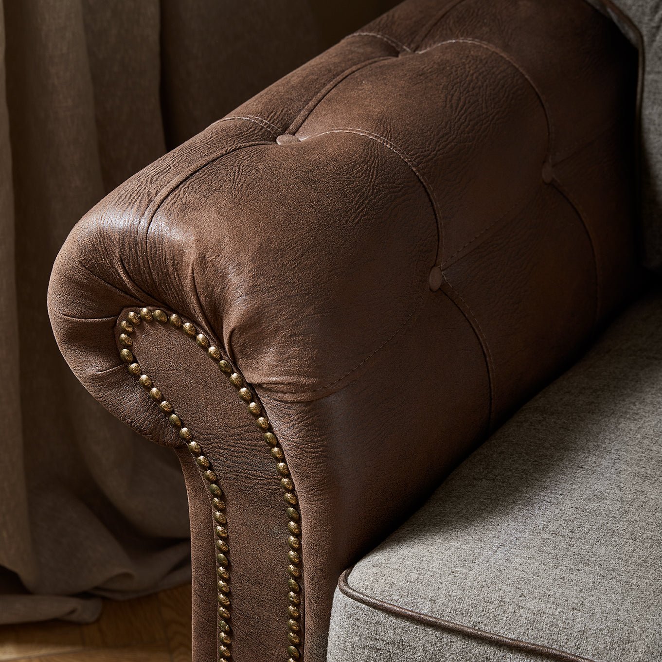 Close-up of Barcelona Two Tone Sofa with button details and leather-look finish, showcasing unique craftsmanship.