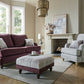 Canterbury Fabric Sofa Collection in a stylish living room setting with footstool and chairs.