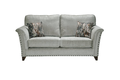 Carrington Fabric Sofa Collection with elegant hand studs and two cushions.