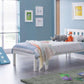 Luna Wooden Bed Frame in white in a modern bedroom with toys and framed art.